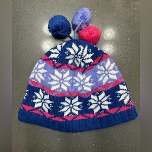 L.L.Bean Kids' snowflake pom hat in blue, pink, and white knit
